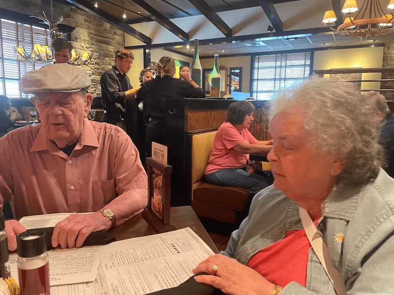 Charles Morgenstern and his wife, Esther, seated at a table at Longhorn Steak House.